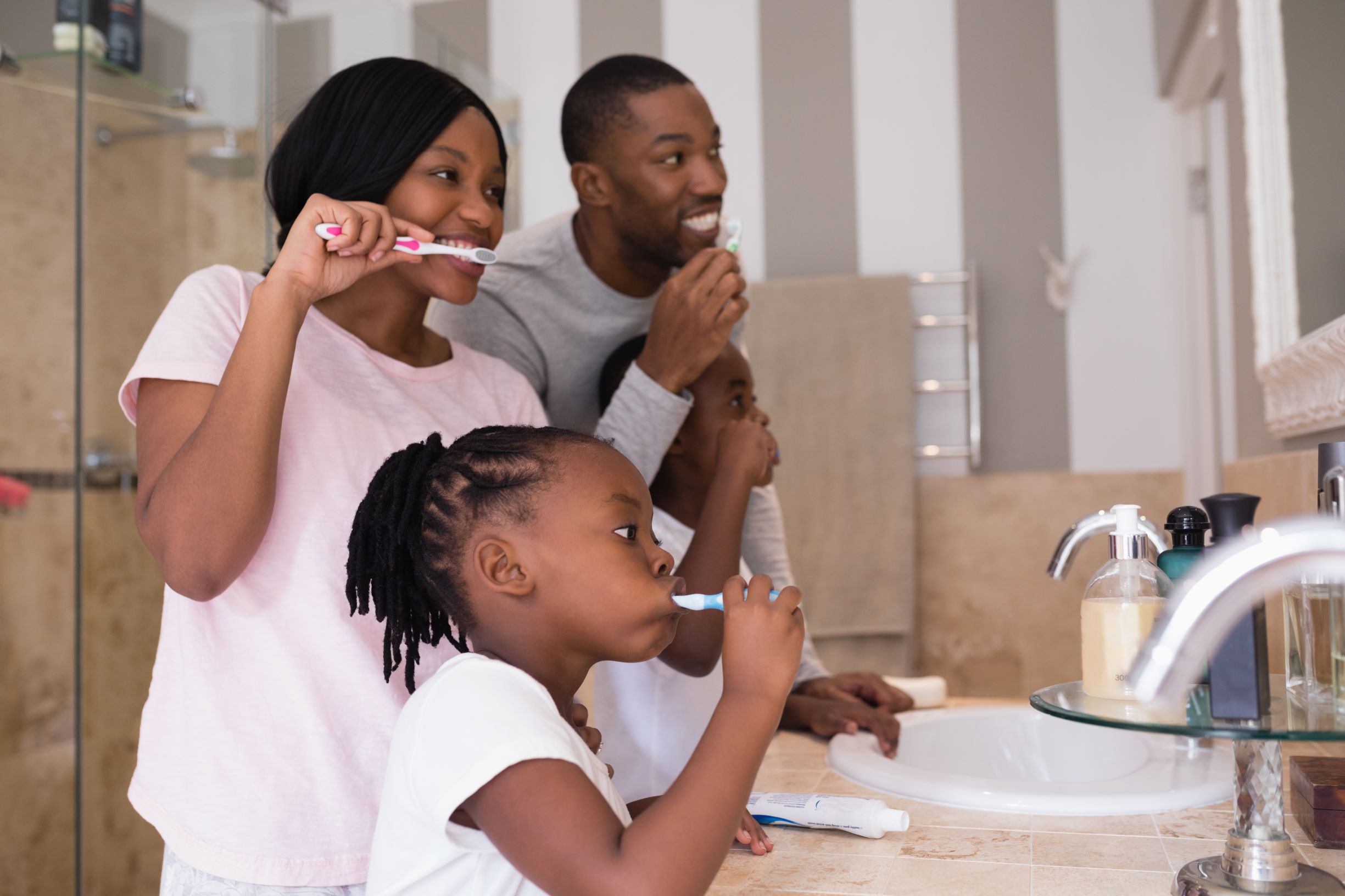 family brushing their teeth